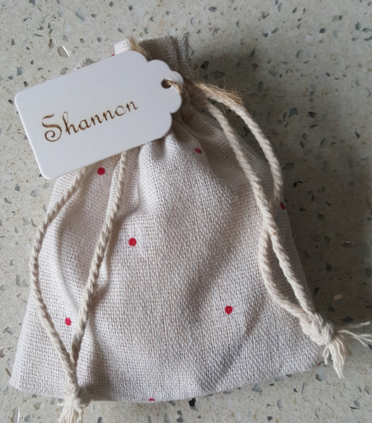 Puzzle Message Pieces in a Decorative Bag.